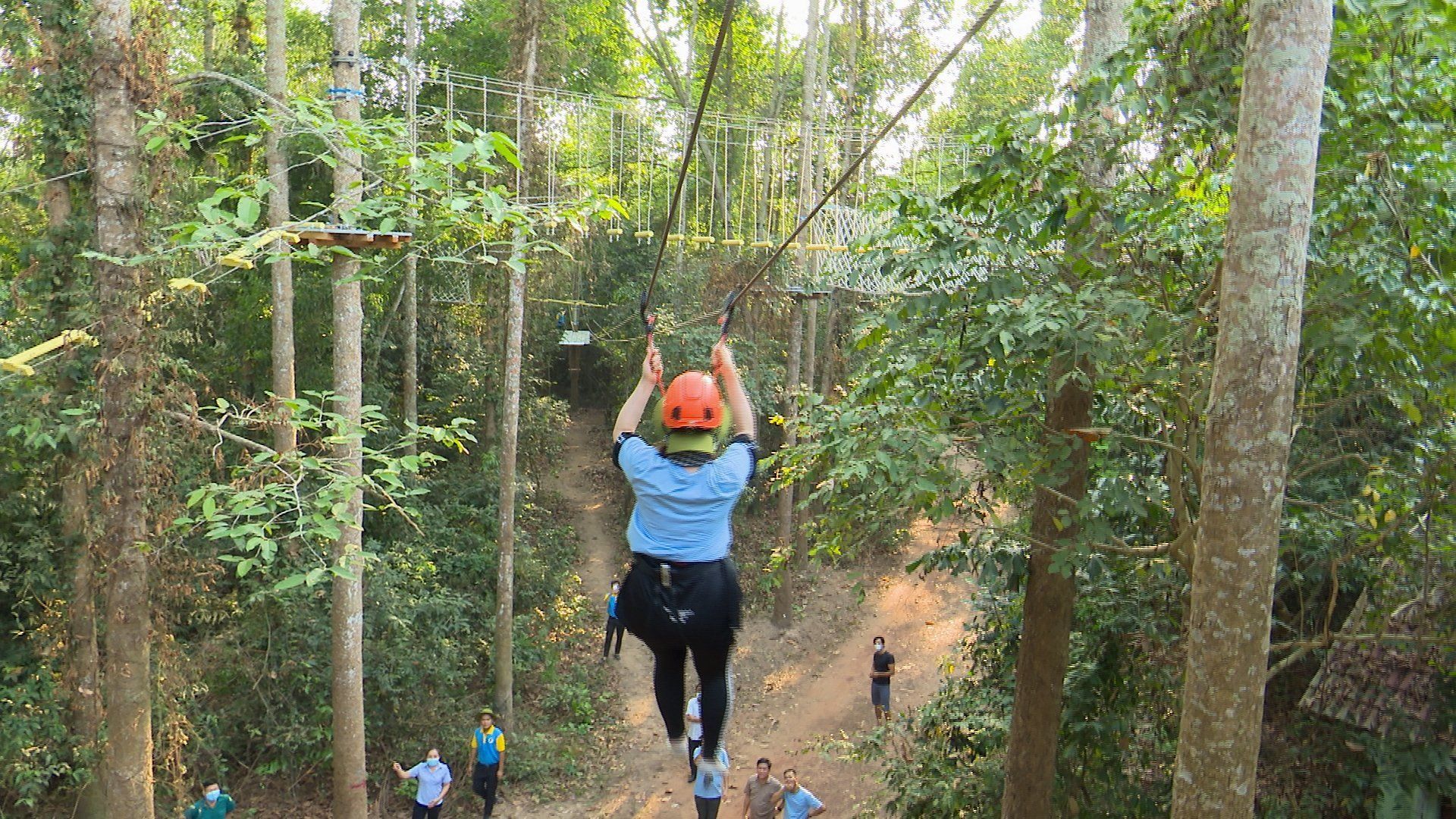 ziplining over green landscapes