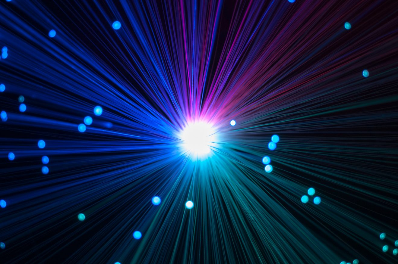 Fibre optic filaments converging on a single bright white point of light