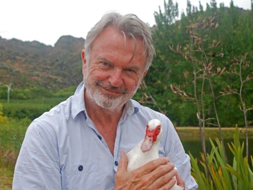 Actor Sam Neill holds a duck