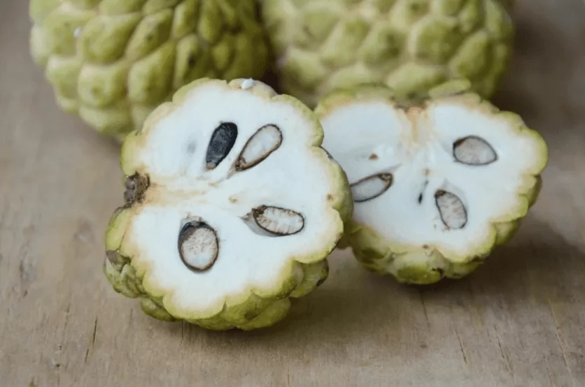 Sweetsop tropical fruit cut on wooden board Sweetsop tropical fruit cut on wooden board